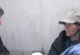 outreach worker and homeless person 