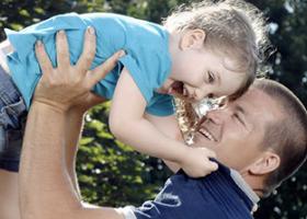 Image of a man holding a child